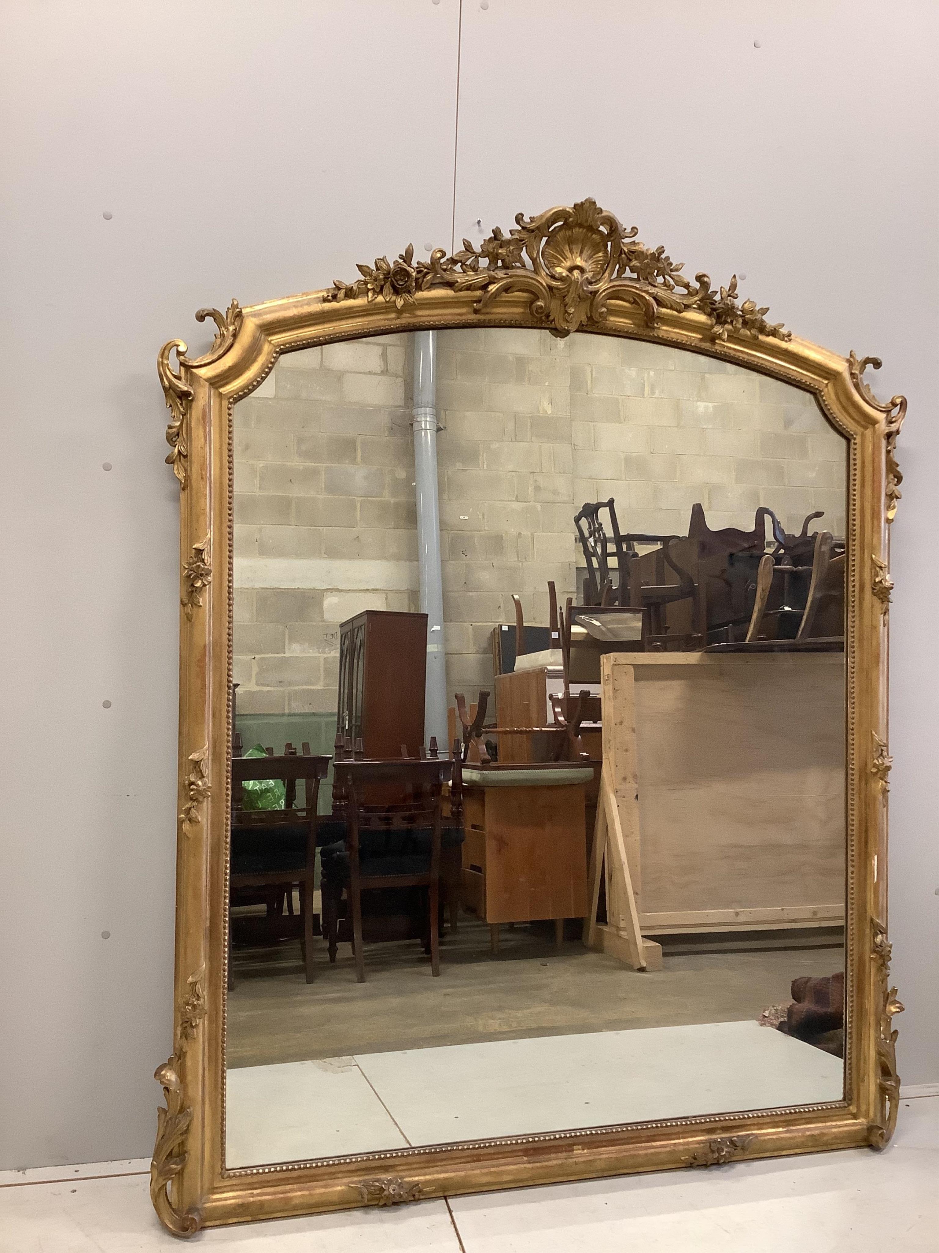 A Victorian giltwood and composition overmantel mirror, width 148cm, height 185cm. Condition - fair to good